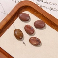 Five oval red jasper gemstone beads for DIY jewelry making on a vintage wooden tray - Red-Brown Mottled Texture Oval Style (36号)