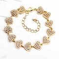 Elegant gold heart link bracelet with micro-p鑲 zircon stones on vintage paper background - Pave Heart / Gold