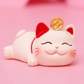 Close-up of white lucky cat figurine with gold coin and red accents on pink background - SJ0001-2 Lying Posture / Extra Large Tray Display Series
