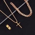 Detailed set of gold cross necklace, Cuban link chain, and hollow-out ring on black stone - Gold Hollow Cross Set