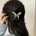 Silver liquid metal butterfly hair claw clip shown on dark hair for stylish back view styling - Hollow Butterfly / Silver