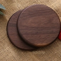 Set of two round dark walnut wood coasters with 10cm diameter on rustic burlap - Black Walnut Round Flat 10cm