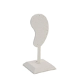 Macro shot of minimalist beige linen ear-shaped stand for earring display - Off White