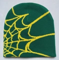 Detailed knit texture and yellow spider web pattern on a dark green beanie - Green with Yellow Web