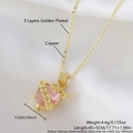 Golden heart pendant necklace featuring a pink zircon stone on white silk background - Gold Plated Heart Pink NAB04-8