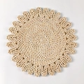 Detailed macro view of handcrafted circular corn husk placemat with floral weaving texture - 30cm / Style E