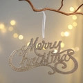 Sparkling gold glitter Merry Christmas ornament with white ribbon on a festive branch - Crystal Hanging Gold Merry Christmas Sign