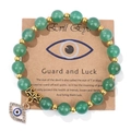 Green natural stone bead bracelet with a golden evil eye charm on a vintage card - 19cm / Green Aventurine