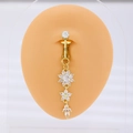 Golden belly ring with crystal flower pendants shown on a silicone body model - Triple Flower Dangle (DZ-1063) / Gold (Non-Piercing)