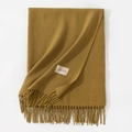 Solid ginger yellow knit scarf with fringe tassels and brand label on white background - 70*200cm / Mustard Green