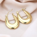 Polished golden U-shaped hoop earrings in thick geometric style on pink silk - Smooth U-Shape / Gold