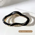 Irregular black and gold wave shark hair clip for women, size 11cm x 6cm - Black