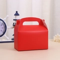 Detail of red gift box showing sturdy paper texture and heart-shaped closure tab - Red