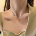 Chic double-layer necklace with a bright orange persimmon pendant on a golden chain - Persimmon Style