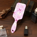 Cepillo para el pelo de oso rosa con lazos decorativos sobre fondo de madera - Estilo A# Lazo Rosa
