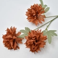 Detailed macro view of artificial rust orange chrysanthemum stems with realistic fabric petals - Brown
