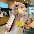 Brown boba tea bear keychain with liquid drifting bottle and golden bell pendant - Bear Milk Tea - Flat Candy Shape