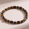 Men's beaded bracelet with wood grain texture, hematite stones, and gold-tone spacers - Style 002 Hematite & Wood