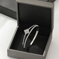 Silver four-leaf clover bangle with crystals in a premium jewelry box presentation - Silver