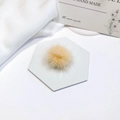 Close-up of soft fluffy mink fur pom pom in pale yellow for DIY hair accessory making - Ginger Yellow