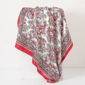 90cm satin scarf with red and white paisley print displayed on a white pedestal - Paisley Red