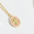 Detailed close-up of a gold oval pendant featuring Virgin Mary relief and pink enamel - Pink Virgin Mary