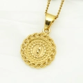 Macro shot of 18K gold plated Virgin Mary pendant with star details and braided frame - SM093 Round Star Virgin Mary Pendant (No Chain)