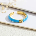 Detail of 18K gold-plated open ring with vibrant blue enamel and sparkling zircon stone - Adjustable Open / Dark Blue