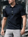 Close-up of navy blue breathable honeycomb mesh polo shirt with chest pocket detail - Navy Blue