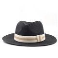Detail of black straw fedora hat featuring a beige striped ribbon and woven texture - Black
