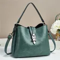 Retro teal bucket bag with textured faux leather and adjustable crossbody strap - Green