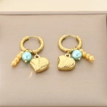 Gold hoop earrings featuring heart charms with blue and gold pearl beads on display - Textured Heart Blue Bead Style (KE118730-SP)
