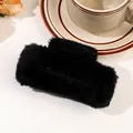 Close-up of black plush shark hair claw clip on table with a coffee cup background - 11cm Square Plush Claw - Black