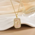 Detailed macro view of 18K gold seahorse tarot pendant with pink enamel and zircons - Gold Seahorse Pink Enamel Style (XL0517)