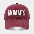 Macro detail of high-quality burgundy washed cotton baseball cap with white MOMMIN embroidery - Burgundy