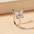 Silver non-piercing butterfly nose cuff with sparkling cubic zirconia on beige backdrop - Butterfly Style (A-1205)