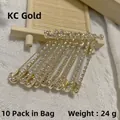 Dix broches en or KC ornées de strass blancs étincelants, poids total de 24g - Lot de 10 / Or KC avec strass blancs