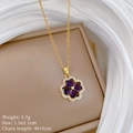 Detail of flower pendant with purple heart stones and gold chain on jewelry box - Purple Heart Clover Necklace (D553)