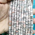 Macro detail of natural gray and pink stone rondelle spacer beads for DIY jewelry making - Pink Opal