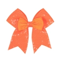 Macro detail of vibrant orange sequin bow hair clip with double-layer grosgrain texture - Orange