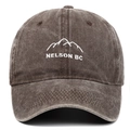 Close-up of Nelson BC mountain embroidery on a washed cotton vintage baseball cap - Coffee