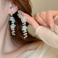 Elegant light blue resin flower tassel earrings with silver finish worn by a model - 2# Flower Tassel Style