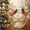 Close-up of Christmas headband with golden glitter antlers, berries, and bells for girls - Gold Antler Headband
