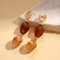 Detail of vintage earrings with gold metal hammered disks and amber resin beads - Earrings - Coffee (with Silver Pin)