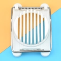 Detailed top view of a white plastic egg slicer with metal cutting wires on a dual-tone base - White