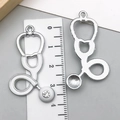 Silver stethoscope pendant with white enamel and rhinestone detail, showing front and back - Large Silver White Stethoscope