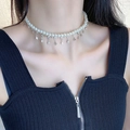 Elegant pearl necklace with silver rhinestone pendants shown on model neckline - Single Layer Pearl Chain with Rhinestone Pendants (DX0241A) / Silver