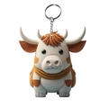Close-up of cute cartoon highland cow keychain with fluffy texture and metal ring - White Body Brown Spotted Highland Cow Style