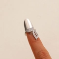 Silver zircon-inlaid fingernail ring with leaf design worn on a female fingertip - Silver Pave Leaf Armor Ring (9196)