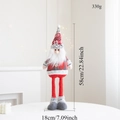 Detail van pluche kerstkabouter met afmetingen van 58 cm hoog en gewicht van 330 g - Kerstman